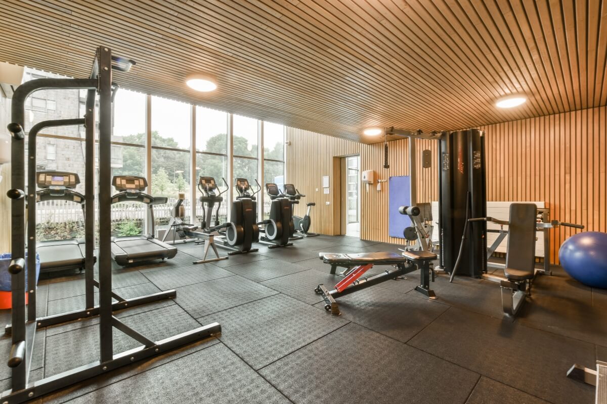 a-gym-with-a-lot-of-exercise-equipment-and-windows-v2-MVWK4G7.jpg